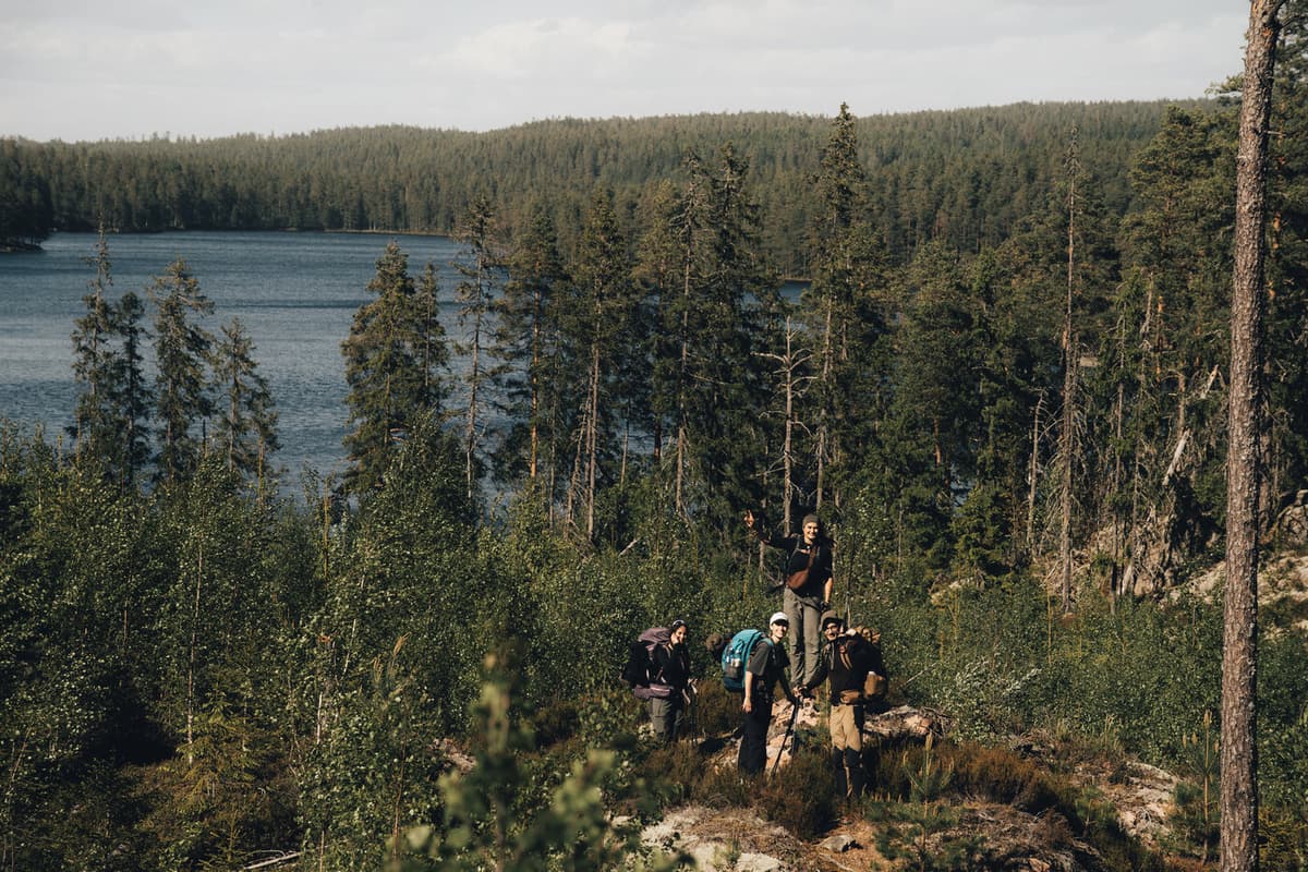 People hiking near a Glaskogen lake.